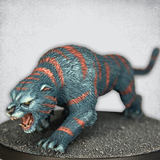 Big Cat by Crooked Dice, a 28mm scale resin miniature representing a large cat in an attack pose with mouth open being great hiding in long grass on your gaming table, as a statue that comes to life in your temple, monster for your RPG or companion in your pulp TV game.
