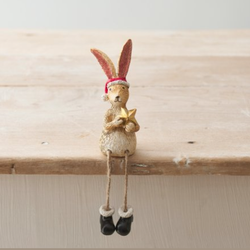 Sitting Santa Rabbit With Star.  A beautiful sitting bunny ornament with dangly legs wearing black boots, a Santa hat  and holding a gold star