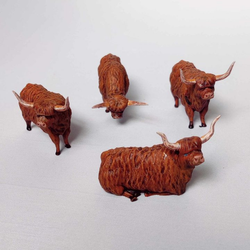 Highland Cows by Iron Gate Surrounds printed in resin to a 28mm scale. With four highlands cows in various poses to help you dress your RPG, farm settings, tabletop games and more.