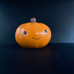 Smiling Ceramic Pumpkin, a super cute little pumpkin with an adorable face that will smile at you and keep you company through your working day or be part of your house decoration, a great edition to your Halloween tier tray or as a gift for a spooky friend.  