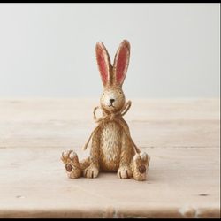 Sitting Rabbit With Bow. A cute bunny figurine sat with its legs out and front paws on the floor, a wonderful edition to your home decor or as a gift.  