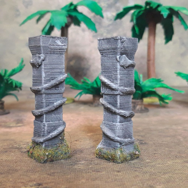A part of two Aztec Snake Columns by Iron Gate Scenery in 28mm scale produced in PLA representing pillars with twisting snakes winding up them adding detail and decoration to your tabletop gaming, RPGs and hobby dioramas.