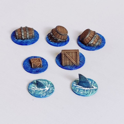 A 28mm scale Flotsam set by Iron Gate Scenery printed in resin consisting of three barrels, two crates and two shark fins for your tabletop gaming table, RPGs and more hobby and gaming needs.