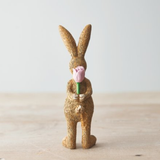 Standing Rabbit With Rose. A cute bunny figurine standing and holding a pink rose behind its back making an adorable gift or edition to your homeware decoration.