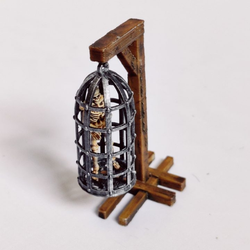 A 28mm scale large Torture Cage from Iron Gate Scenery printed in PLA with one stand, one skeleton and one large cage for your dungeon setting, RPGs, tabletop games and more hobby and gaming needs.