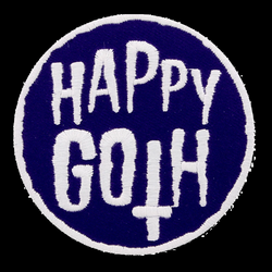 Happy Goth Iron On Patch, 100% cotton embroidered patch with iron on adhesive backing. A round patch with purple background and white writing for your bag, jacket, hat and more.   