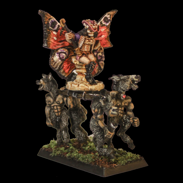 Fae Queen by Oakbound Studio. A multipart lead pewter miniature supplied with a 60mm round lipped bases. The Queen wears a skeleton mask and rides upon her throne carried by donkey like creatures with her glorious wings outstretched