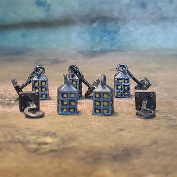 A pack of Lanterns from Iron Gate Scenery, printed in PLA for 28mm scale giving you decoration for your miniatures, D&amp;D, dungeon dressing, tabletop games, dioramas and more.