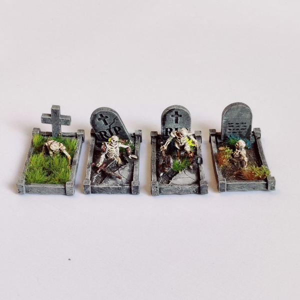 A pack of four Skeleton Grave Surrounds by Iron Gate Surrounds printed in resin to a 28mm scale. Fantastic grave surrounds (headstones not included) with skeletons coming out of the ground making a wonderful edition to your&nbsp;Halloween dioramas, RPGs, dungeon settings, tabletop games and more