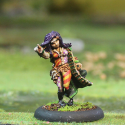Guillare by Oakbound Stuido. A lead pewter miniature of a female with her hair down, wearing a long coat and pointing the way for your tabletop and RPGs. 