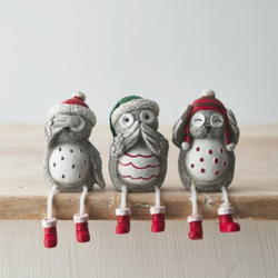 Grey Nordic Hear No Evil, See No Evil, Speak No Evil Sitting Christmas Owls With Dangling Legs. An adorable set of three sitting owls wearing festive hats