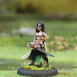 Cacciatore 4 by Oakbound Stuido. A lead pewter miniature of a female with her hair down, wearing a cropped bra top and boots, holding a sword for your tabletop and RPGs. 