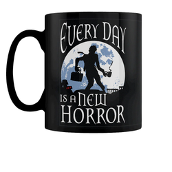 Every Day Is A New Horror Mug.  A black mug with white writing, moon a silhouette of a person in a zombie pose carrying a briefcase in one hand and mug in the other ready for another day at work, a great edition to your mug collection or as a gift for a work colleague. 