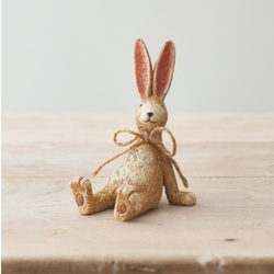 Laid Back Sitting Rabbit With Bow. A cute bunny figurine sat with its legs out and front paws on the floor behind in a relaxed pose with pointed ears, happy smile and a jute string bow. A wonderful edition to your home décor or as a gift.   