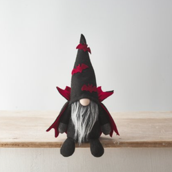 Dracula Gonk! This thirty centimetre sitting gnome comes complete with attached spooky cloak and swarming red felt bats on its hat 