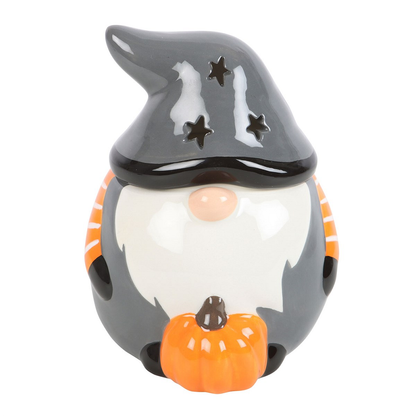 Add a touch of Halloween charm to your home with this Halloween Gonk Oil Burner. This festive gonk, wearing a grey top with orange and white stripe sleeves, features a star cut out design on the hat giving a magical glow, making it the perfect seasonal décor. Bring the magic of Halloween into your space with this cute oil burner
