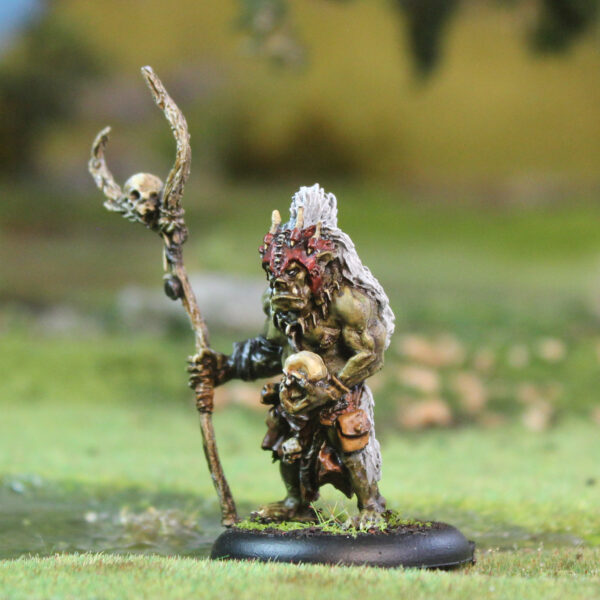 Stallu Noaidi by Oakbound Studio. A multi part lead pewter miniature of a warrior shaman holding a skull in one hand and a staff in the other