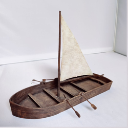 A large boat from Iron Gate Scenery in 28mm scale for your tabletop gaming needs includes boat, rudder, sail and oars in PLA sculpted by Devon Jones.