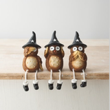 A set of three see no, hear no, speak no evil dangly leg owls wearing black witches hats 