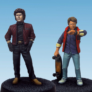 Heroes 4 by Crooked Dice.&nbsp; A set of two metal figures representing two male heroes one holding a skateboard, wearing a bodywarmer and looking at his watch with the other a stylist man wearing gloves and a short jacket that would be great as npcs in your RPG, a gift for a 80's fan, dioramas and tabletop gaming needs