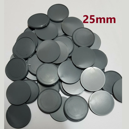 A pack of 50 25mm round lipped bases from Tabletop Workshop, made of hard plastic grey, suitable for gluing and painting, supplied loose as singles.