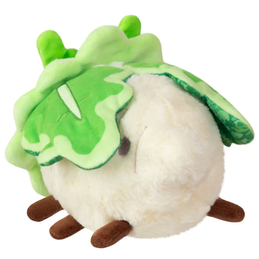 Plush toy resembling a leafy gre...