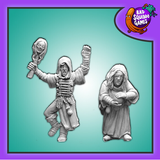 Bad Squiddo Games Shaman & Apprentice. A pack of two metal miniatures by Bad Squiddo Games representing a female shaman and her apprentice, the older shaman has a bandage across her eye while the more spry apprentice raises bandaged arms and adorns a chest plate of bones