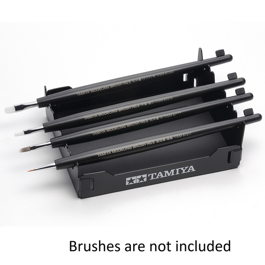 Black brush stand on a white bac...