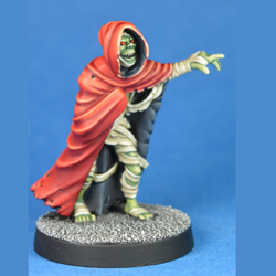 Abomination by Crooked Dice a white metal 28mm miniature for your tabletop games, a mummified creation with bandages hanging off and wearing a cloak that you could use in many RPGs or 80s nostalgia games. 