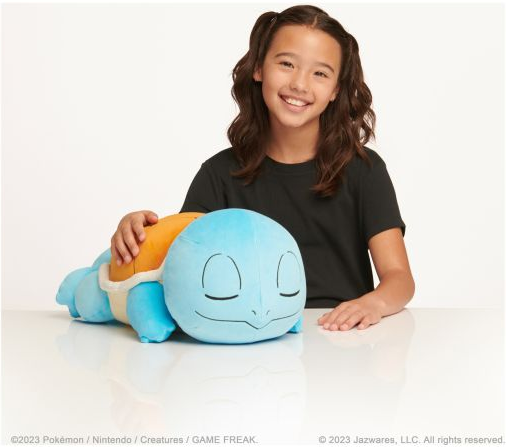 A Squirtle plush toy lying down,...