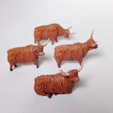 Highland Cows by Iron Gate Surrounds printed in resin to a 28mm scale. With four highlands cows in various poses to help you dress your RPG, farm settings, tabletop games and more.