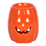 An orange pumpkin oil burner and wax burner for your Autumn home décor, with a happy Jack O Lantern face on the front.