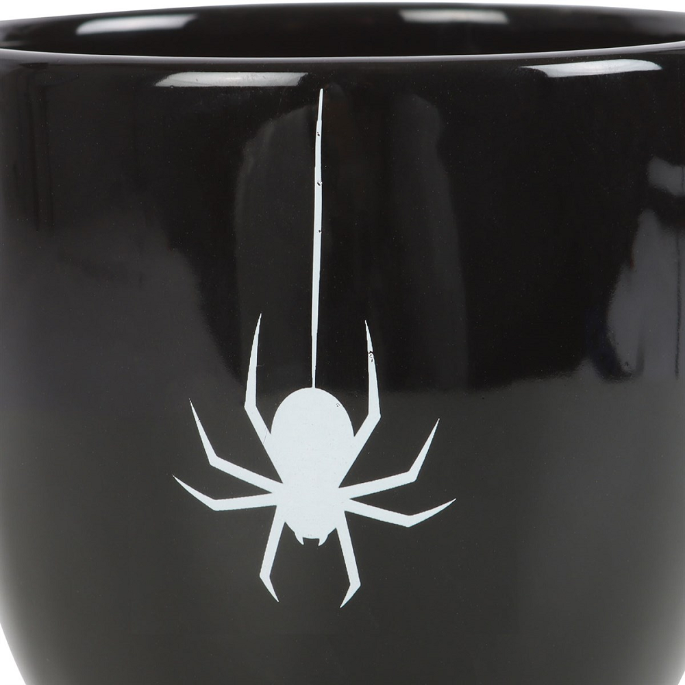 The mysterious Spider Teacup boasts a black, thorny handle, with a striking white spider accent for a touch of spooky style. A perfect addition to any elegant and sophisticated kitchen or home ware collection