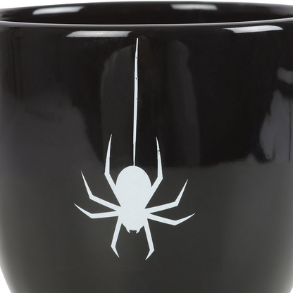 The mysterious Spider Teacup boasts a black, thorny handle, with a striking white spider accent for a touch of spooky style. A perfect addition to any elegant and sophisticated kitchen or home ware collection