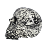 Abstraction Skull by Nemesis Now. This eye-catching piece has hand-painted detail along with a monochrome butterfly and checkered pattern