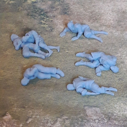 Dead Men by Iron Gate Scenery printed in resin for 28mm scale with four single dead men and one with two dead men together to help you decorate your tabletop games, RPGs, wargames and other hobby needs.