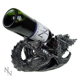 Dragon Guzzler Wine Bottle Holder by Nemesis Now. A dragon laid on its back holding a bottle in its back and front legs with the neck of the bottle in its mouth 