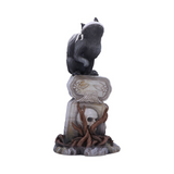 Gothic skull cat by Martin Handford from Nemesis Now. Perched on top of an ornate gravestone this black feline with green eyes and exposed skull and spine with add an unusual edition to your cat figurine collection for Halloween and all year round.