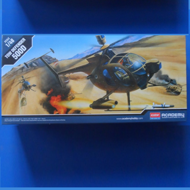 Academy Tow Defender 500D 1/48 scale plastic model kit. Hughes 500D helicopter with engraved panels, cockpit detail, spinning rotor, and figures.