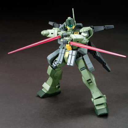Model kit of a green robot with red blades on a dark background