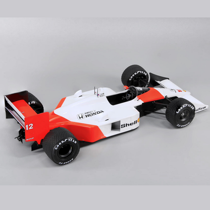 BeeMax McLaren MP4/4Model of a Formula 1 car with visible branding on a grey background 