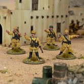 Toy soldiers in desert setting w...