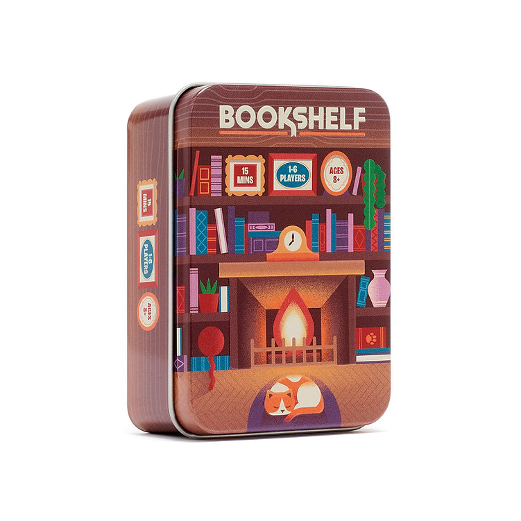 A square metal tin box for a game called BOOKSHELF, featuring a colorful illustration of a cozy bookshelf with a fireplace, books, and a sleeping fox on the front, shown on a plain white background. Bookshelf - Tinned Building Game