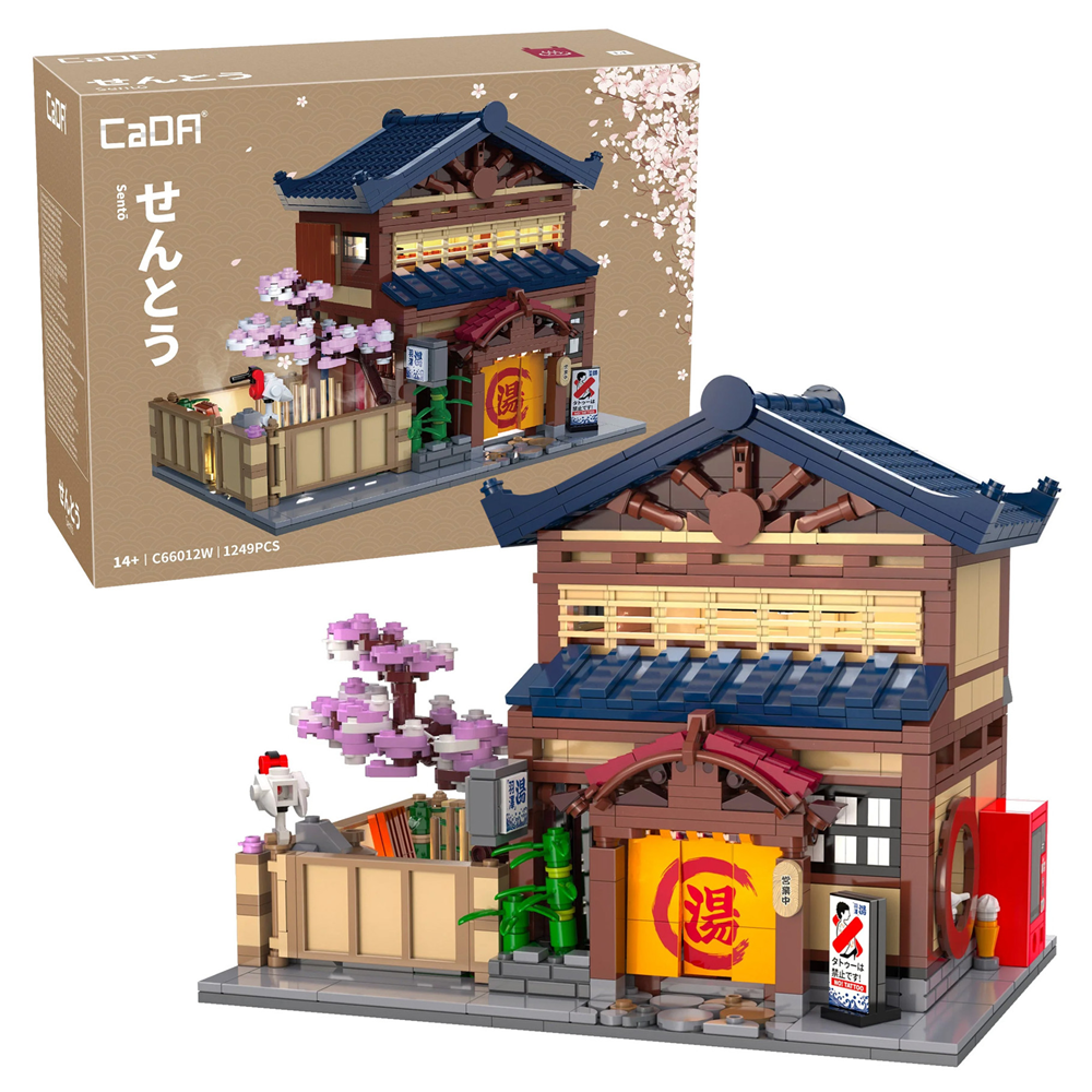 Model of a traditional Japanese building with cherry blossom tree and packaging displaying 'CaDA' brand. CaDA Japanese Sento Bathhouse C66012W 1249 piece building brick model with LED lighting