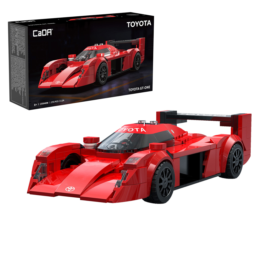 Red toy race car with Toyota branding in front of its packaging. CaDA Toyota GT-One 1:24 scale brick-built Le Mans racing car model