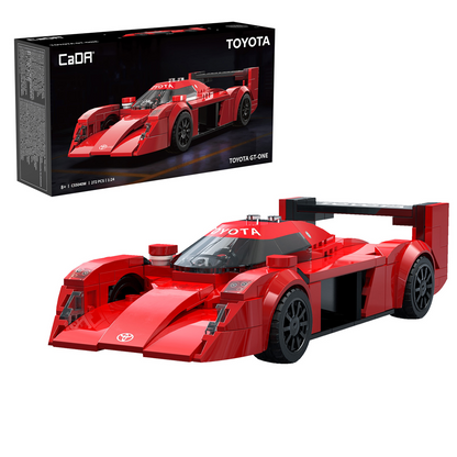 Red toy race car with Toyota branding in front of its packaging. CaDA Toyota GT-One 1:24 scale brick-built Le Mans racing car model