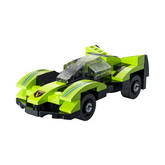 Green toy car model on a white b...
