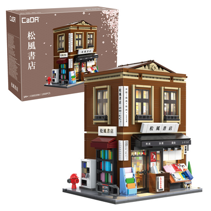 Model of a bookshop building with CaDA branding and packaging. Japanese Bookshop Building Brick Model Kit