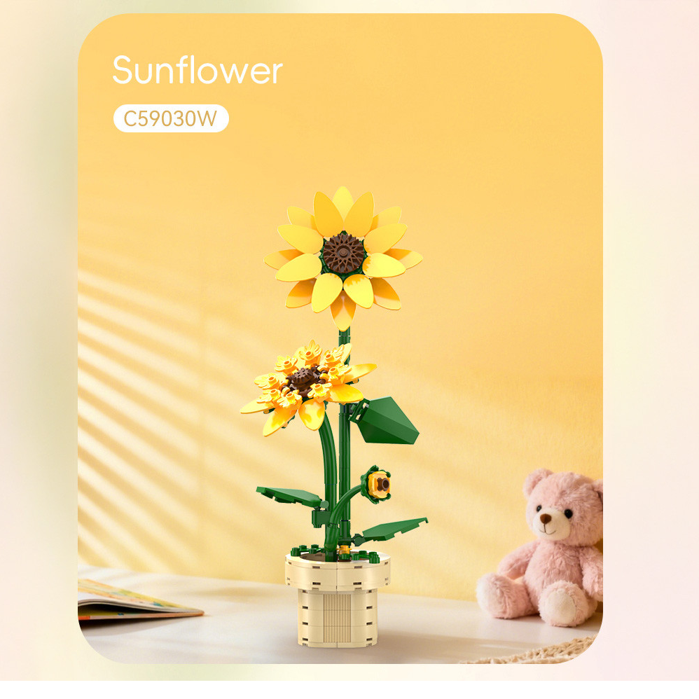CaDa Sunflower. Sunflower model with a teddy bear on a yellow background