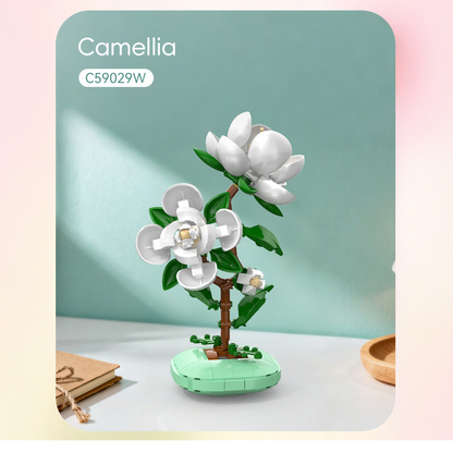 CaDa Model of a camellia plant made from building blocks on a light green background
